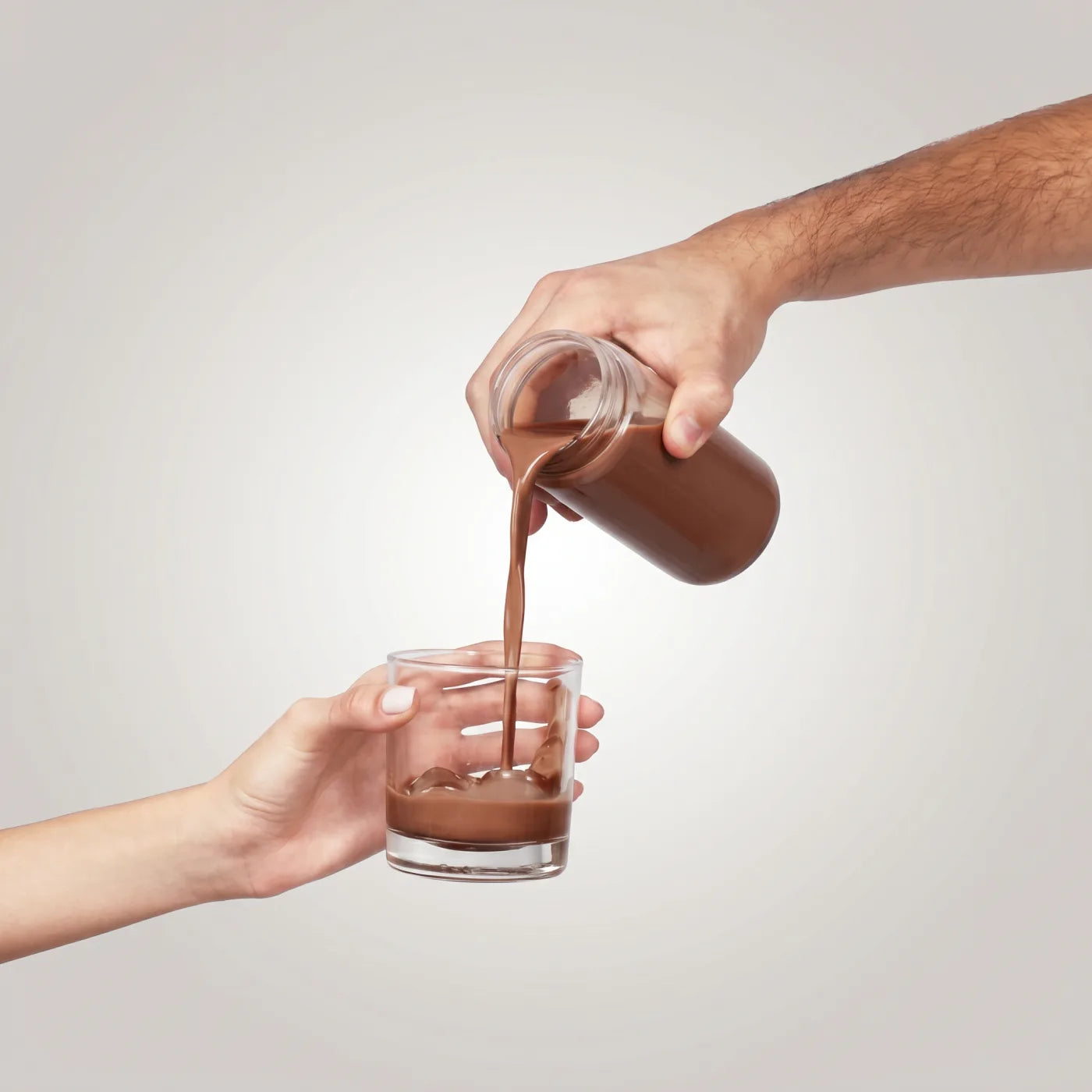 Pouring the prepared Thunder Honey cacao, one glass for two