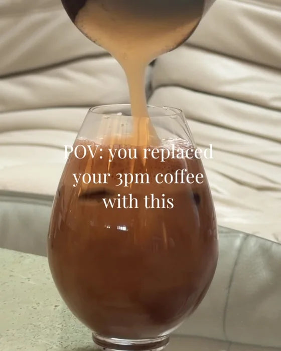 Hot cacao poured into a round glass, with the words POV: you replaced your 3pm coffee with this